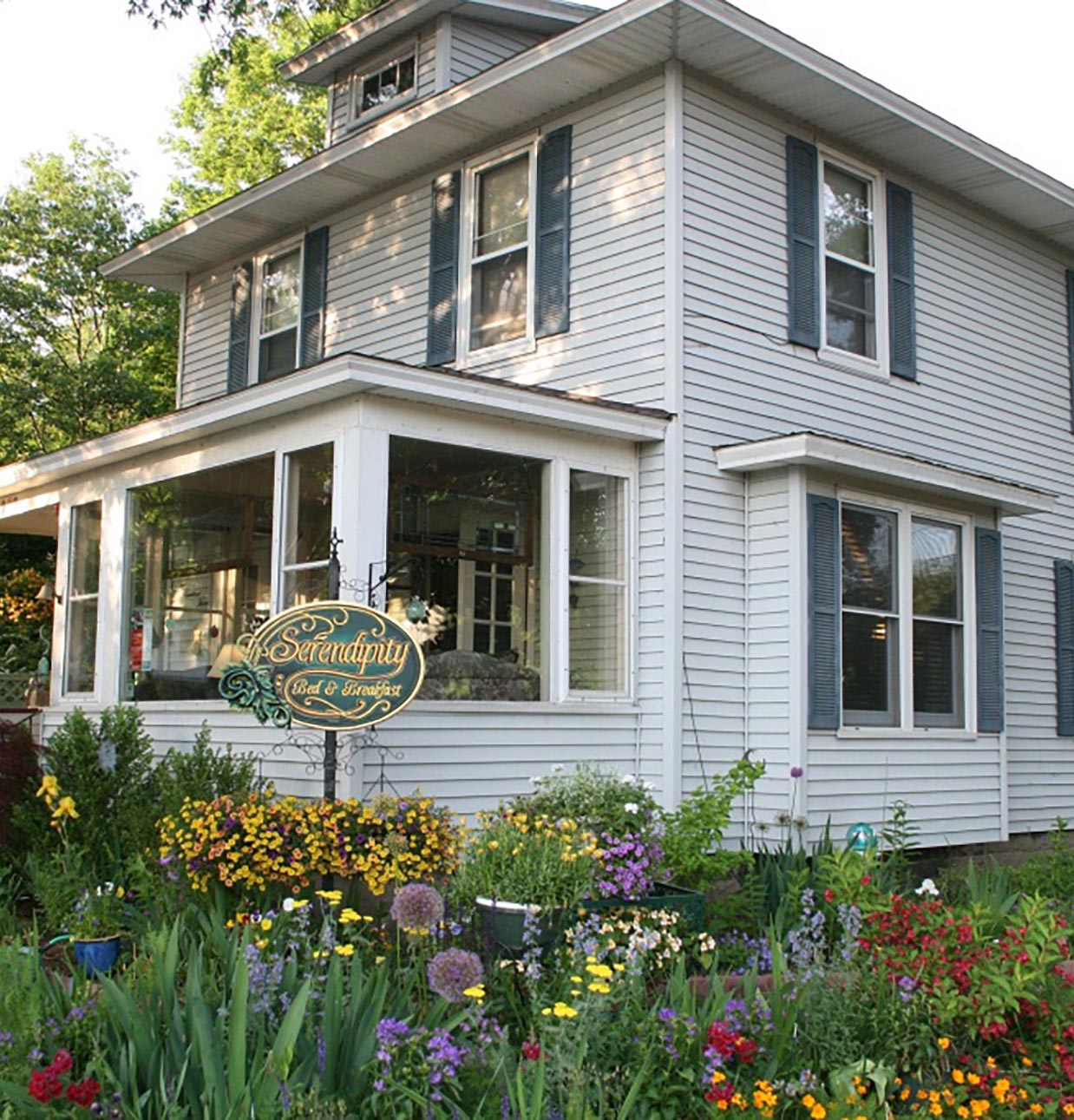 Exterior and front gardens of Serendipity Bed & Breakfast in downtown Saugatuck, MI